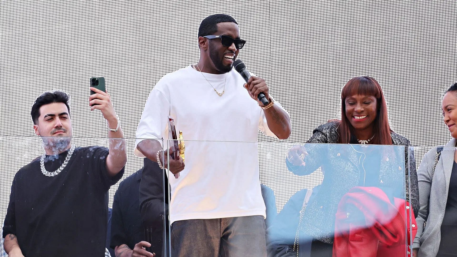 Sean "Diddy" Combs speaks to the crowd after being presented with the key to the city by New York Mayor Eric Adams in Times Square (Image via Getty)